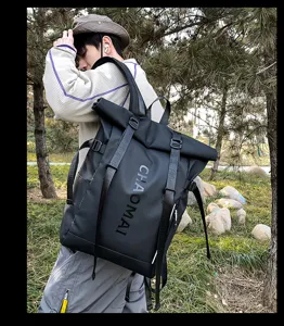 Stylish black roll-top backpack for men and women, large capacity travel and school bag.