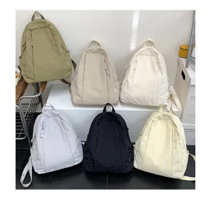 Casual solid color backpack for women, lightweight travel school bag, daily college student class.