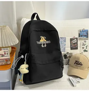 Casual black canvas school backpack with cute dog graphic and spacious compartments for daily use.