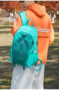 Outdoor waterproof backpack detail view, lightweight hiking travel school bag in bright cyan.