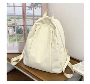 Korean minimalist solid color canvas casual backpack for women, lightweight daily travel bag.