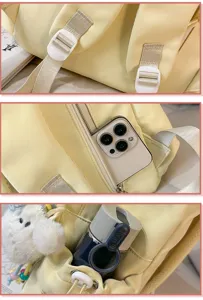 Detailed view of yellow student backpack with adjustable straps, zipper pocket, and side pocket.