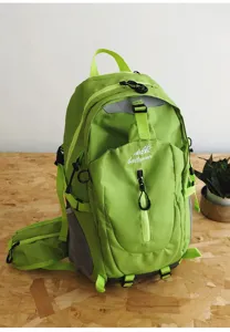 Detail shot of the lime green outdoor hiking backpack, featuring durable fabric and multi pockets.