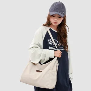 Japanese minimalist large canvas shoulder bag for women, versatile casual tote bag.