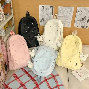 Cute aesthetic college style canvas backpack for women school bookbag with cute embroidery.