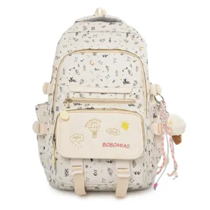 Zaino scolastico in tela stampata per ragazze, grande zaino da viaggio con un grazioso ciondolo.