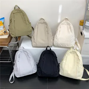Korean ins style solid color casual backpack for women, lightweight travel school bag for students.