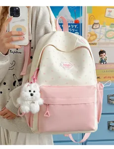 Cute Japanese style sweet pink white student backpack detail showing lovely puppy pendant and design.