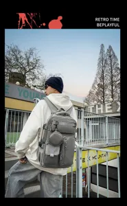 Large capacity multi-pocket grey tactical backpack stylish student bookbag for daily travel.