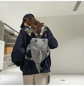 Cute grey shark backpack for men and women, trendy casual crossbody bag and travel daypack.