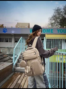 Outdoor lifestyle detail view of a large capacity multi-pocket khaki canvas travel backpack.
