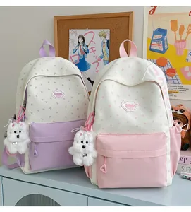Cute Japanese style canvas school backpack with star pattern and sweet dog pendant for students.