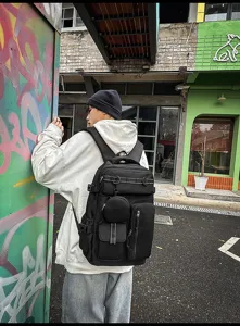 Detail view of large capacity multi pocket travel backpack, unisex casual bag for daily use.
