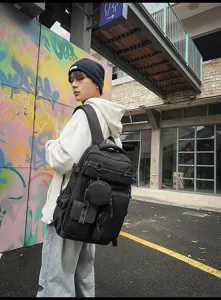 Large capacity multi-functional black backpack for men, casual travel daypack with extra pockets.