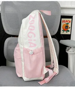 Detail view of the cute pink and white Japanese style student backpack with letter print.
