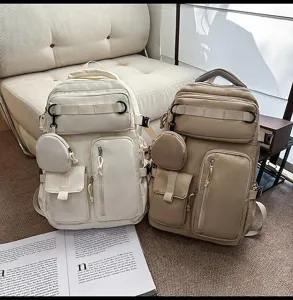 Multi-pocket canvas casual backpack with large capacity, ideal for travel and daily use.