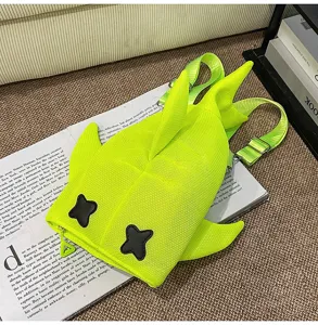 Detail view of trendy neon green shark backpack, cute casual bag for men and women daily use.