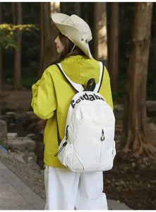 Outdoor waterproof casual backpack detail view showing white fabric and front pocket design.