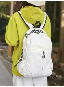 Outdoor waterproof white backpack detail view, lightweight travel daypack with secure zipper.
