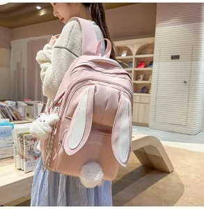 Detailed view of cute pink bunny ears backpack with fluffy tail, ideal for daily campus life.