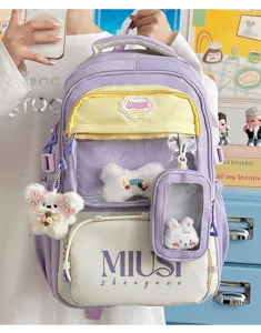 Japanese style cute student backpack with transparent front pocket and lovely plush charms.