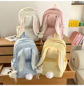 Cute Japanese style bunny ears backpack for women, multi-color school bag with plush tail.