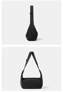 Detailed view of the black nylon crossbody bag, showing the adjustable strap and zipper.