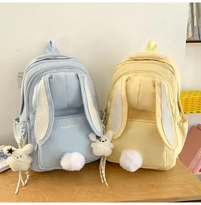 Detailed view of cute Japanese style bunny ears backpack with plush tail and bunny pendant.