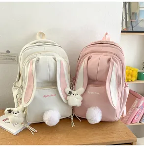 Cute Japanese Harajuku style bunny ears backpack detail, showing plush tail and pocket.