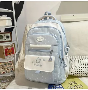 Sac à dos d'écolier de style japonais doux avec des motifs d'étoiles et de pois pour les filles.