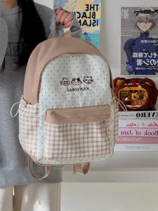 Japanese style cute plaid polka dot student backpack with multi pockets for girls daily use.