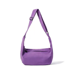 Detail view of the purple casual crossbody shoulder bag showing the adjustable strap and zipper.