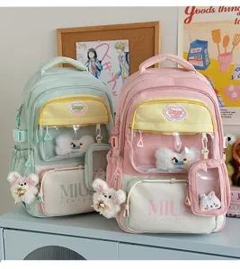 Cute Japanese style student backpack with clear window pocket and cute plush bunny charm design.