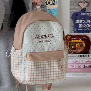 Cute Japanese ins style plaid backpack for women and students, casual daily school bag.