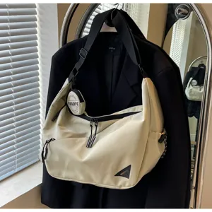 Casual streetwear messenger bag detail, tactical canvas shoulder bag with pouch for commuting.