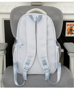 Detailed view of the light blue casual school backpack back design with adjustable straps.