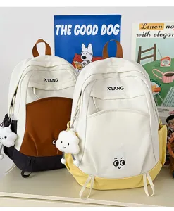 Large capacity colorblock student casual backpack detail view featuring cute cloud keychain