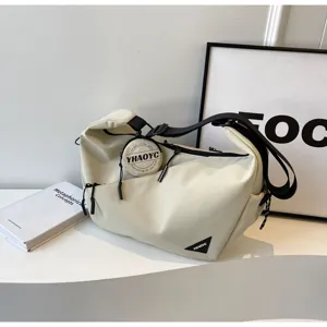 Casual canvas crossbody bag for men and women, stylish utility messenger bag for daily commute.