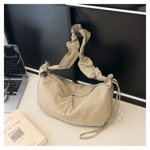 Close-up of the stylish ruched nylon shoulder bag detail, elegant slouchy design for daily use.