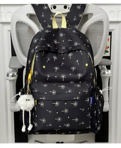 Close-up of black backpack featuring cute dandelion print, yellow accents and fluffy charm detail.