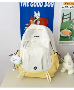 Large capacity color blocked school backpack for women, casual travel bookbag with cute charm.