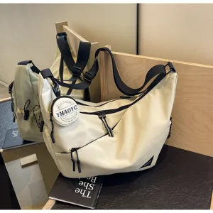 Casual canvas messenger bag for men and women, stylish commuter crossbody bag with strap.