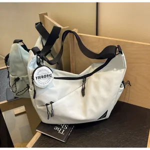 Casual canvas crossbody messenger bag for men and women, stylish commuter shoulder bag with pocket.