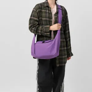 Large capacity casual purple crossbody shoulder bag for daily commute, travel and school use.