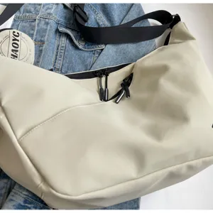 Casual commute shoulder bag for men and women, stylish workwear messenger bag in light beige.