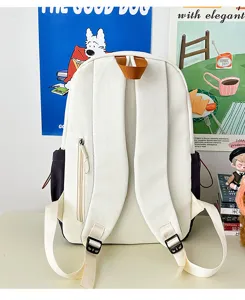 Large capacity color-block student backpack detail showing comfortable straps and zipper pocket.