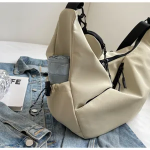 Detail shot of beige tactical crossbody bag with multi pockets, casual canvas messenger bag.