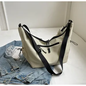 Casual tooling style crossbody bag for men and women, commuter messenger bag with thick strap.