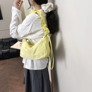 Casual yellow ruched shoulder bag, large nylon crossbody dumpling bag for daily commute.