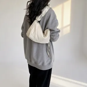 Casual nylon dumpling crossbody bag, large capacity stylish shoulder hobo bag for daily commute.